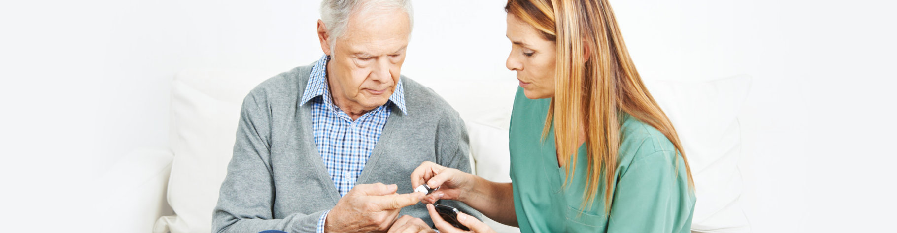 nurse checking blood sugar